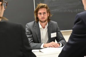 Law student negotiating in the intramural transactional competition.